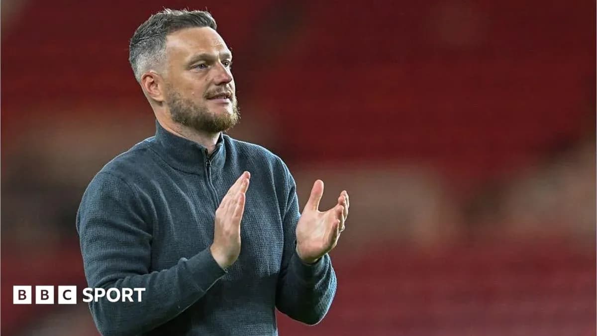 Coach applauding during a match at stadium