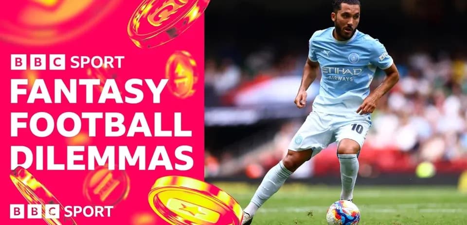 Player in light blue kit dribbling on the pitch