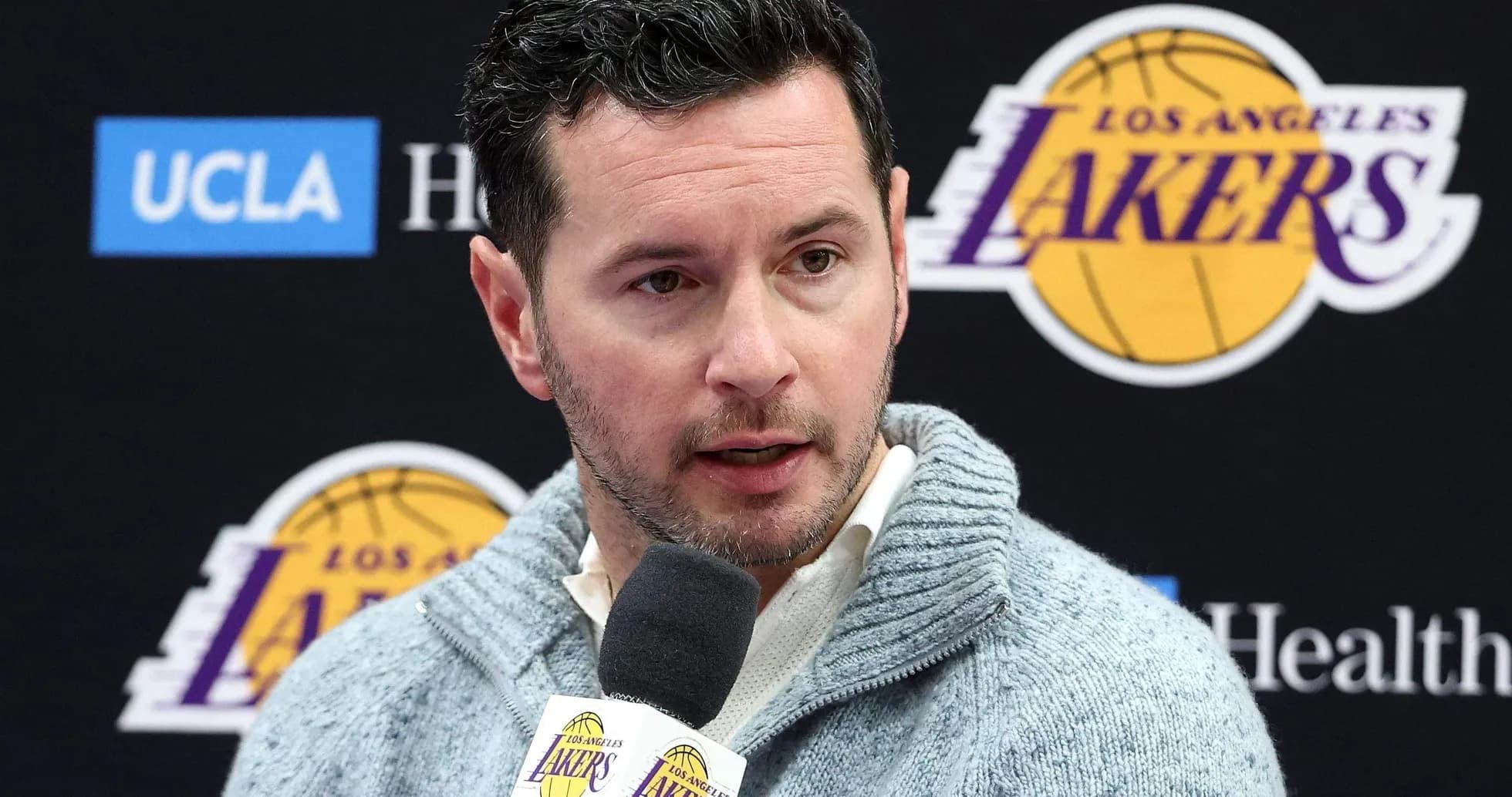 Official speaking at Los Angeles Lakers press conference