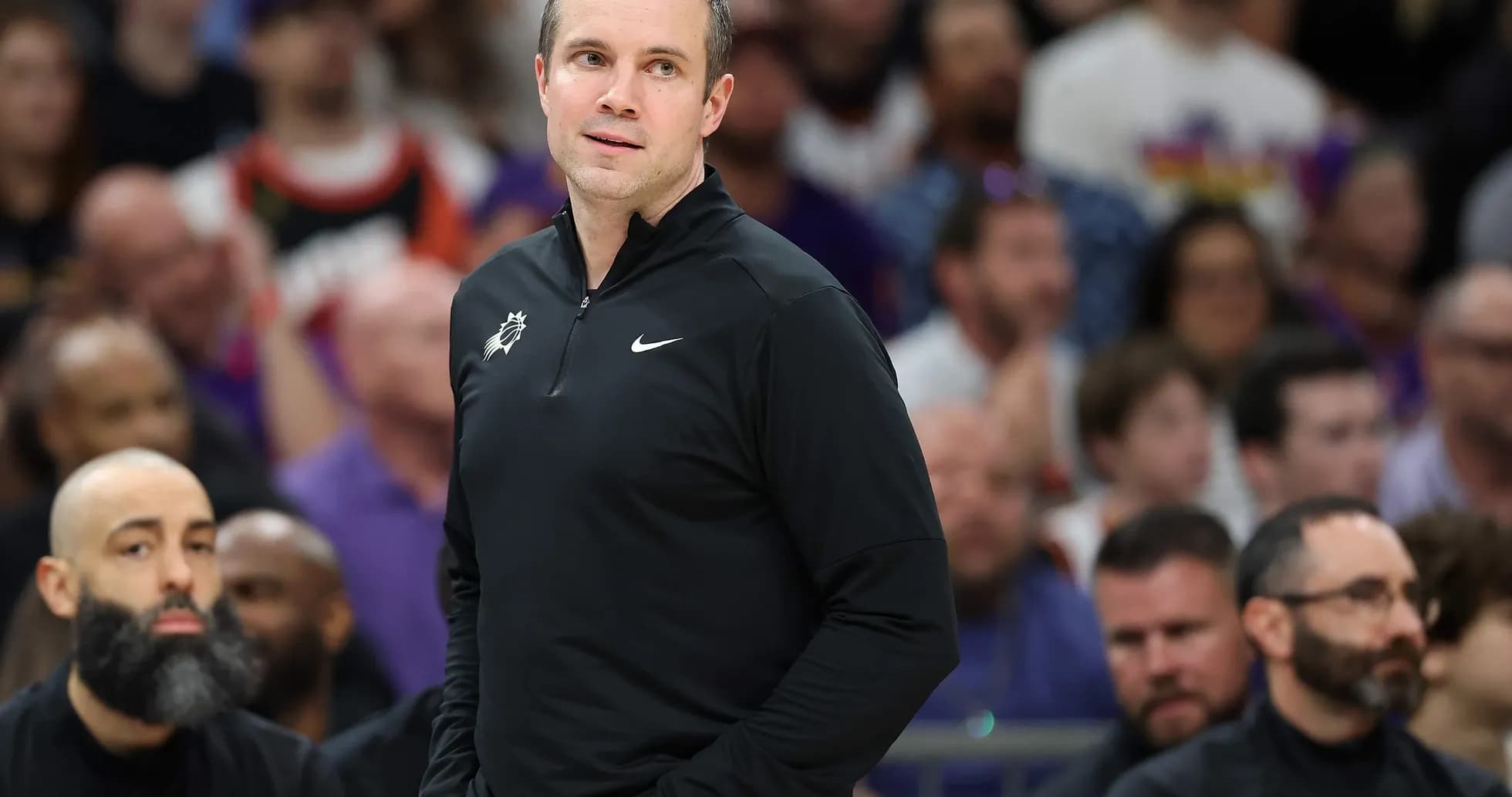 Coach observing game from the sideline