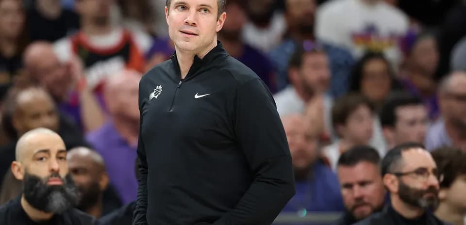 Coach observing game from the sideline