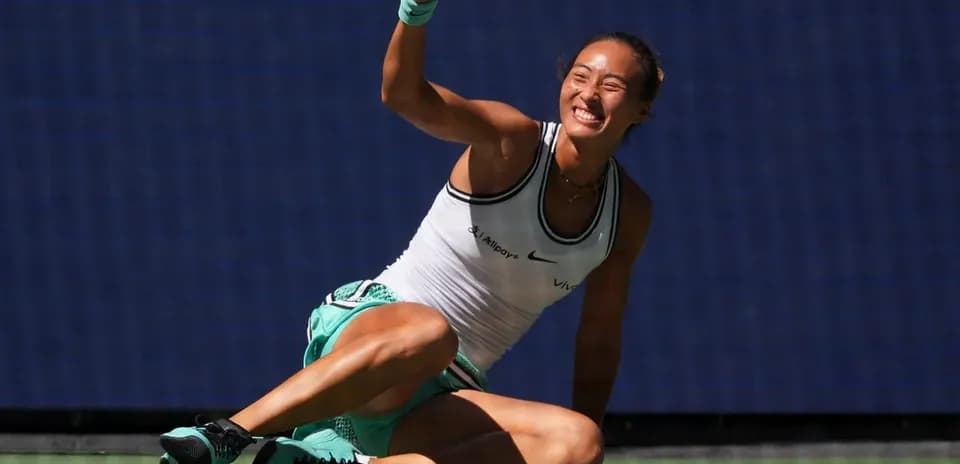 Tennis player celebrating on the court after winning