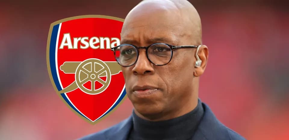 Man wearing glasses with Arsenal logo in background