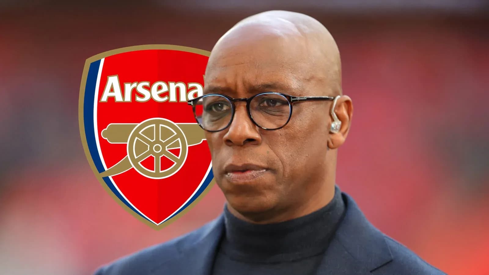 Man wearing glasses with Arsenal logo in background