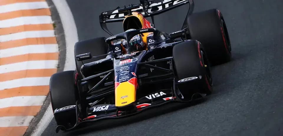 Formula 1 car navigating a curved track