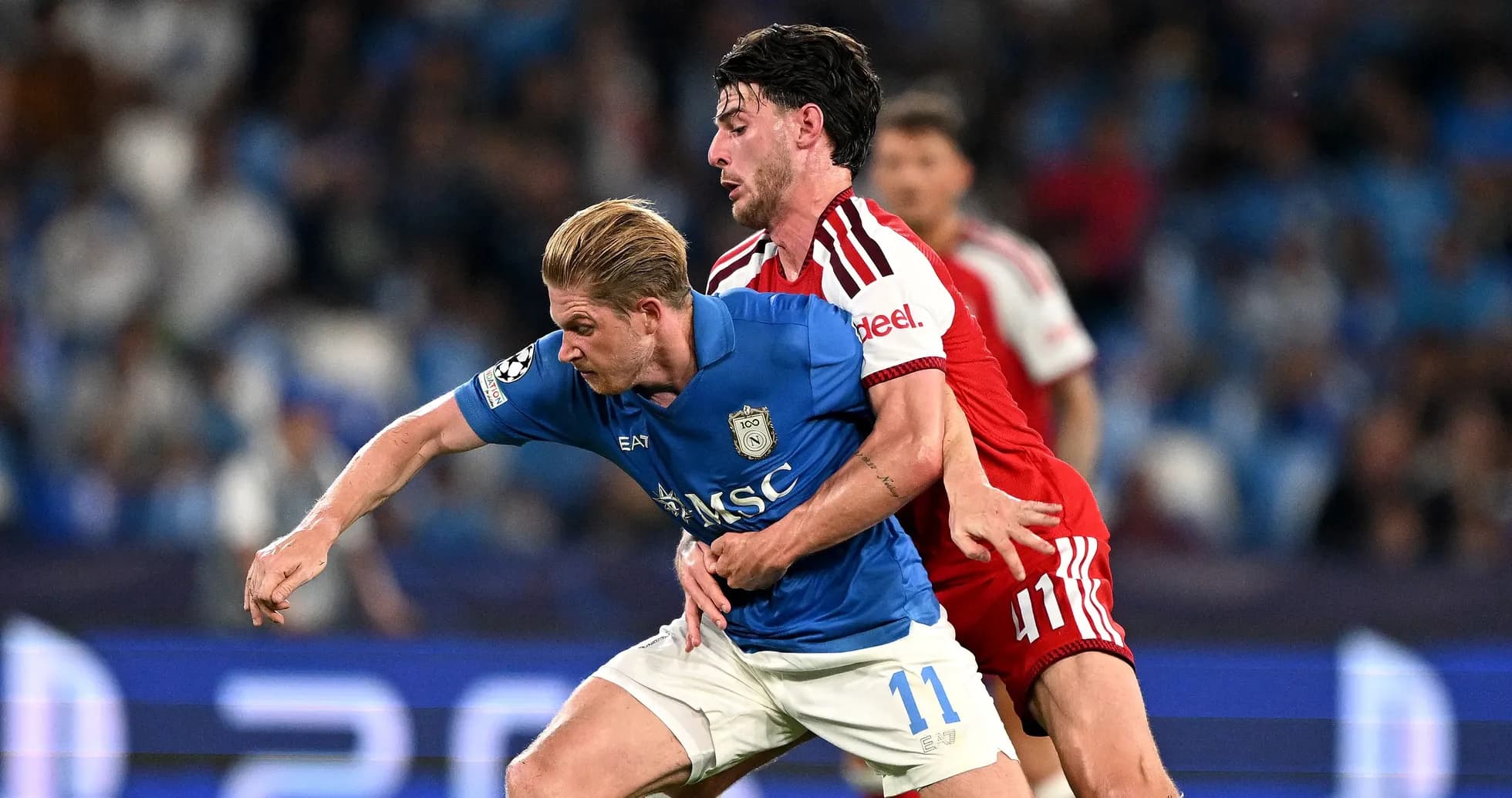 Two players competing for possession during match