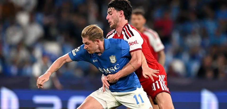 Two players competing for possession during match