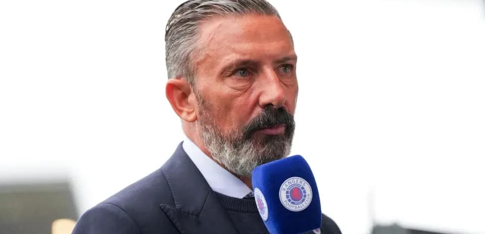 Person speaking into a microphone at event