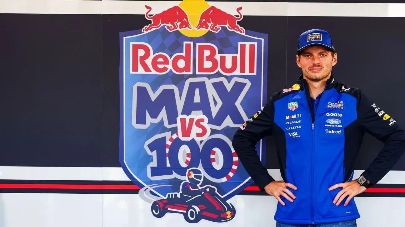 Driver posing in front of Red Bull promotional backdrop