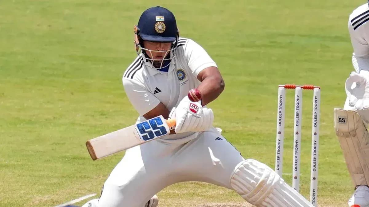 Batsman playing a shot during a cricket match