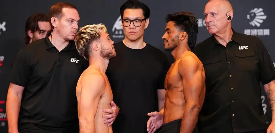 Two fighters facing off at UFC weigh-in event