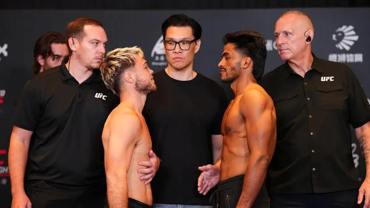 Two fighters facing off at UFC weigh-in event