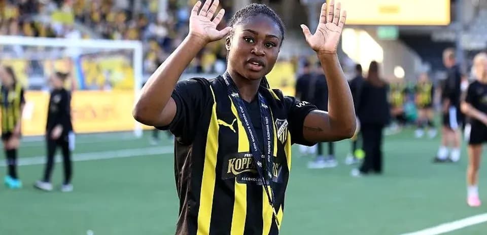 Player waving with hands on the field