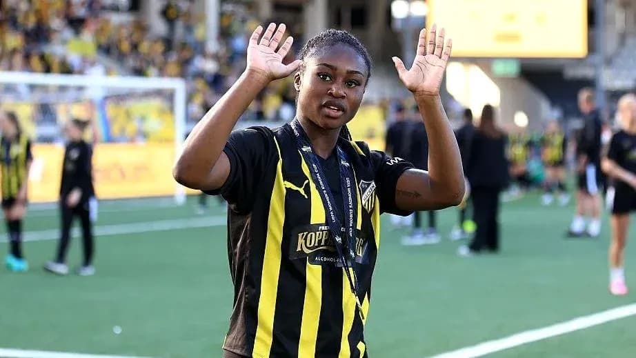 Player waving with hands on the field