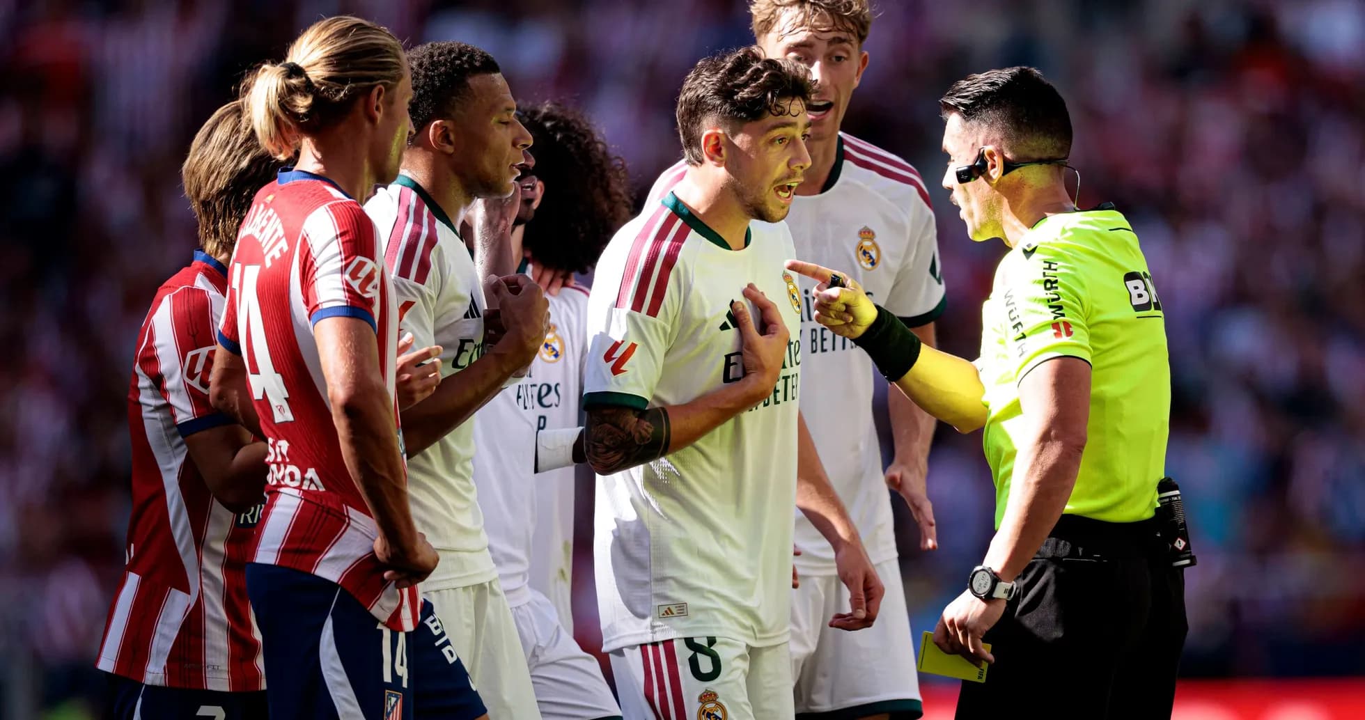 Players arguing with referee during heated match