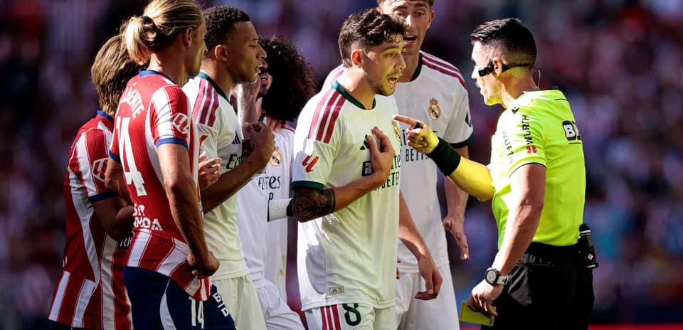 Players arguing with referee during heated match