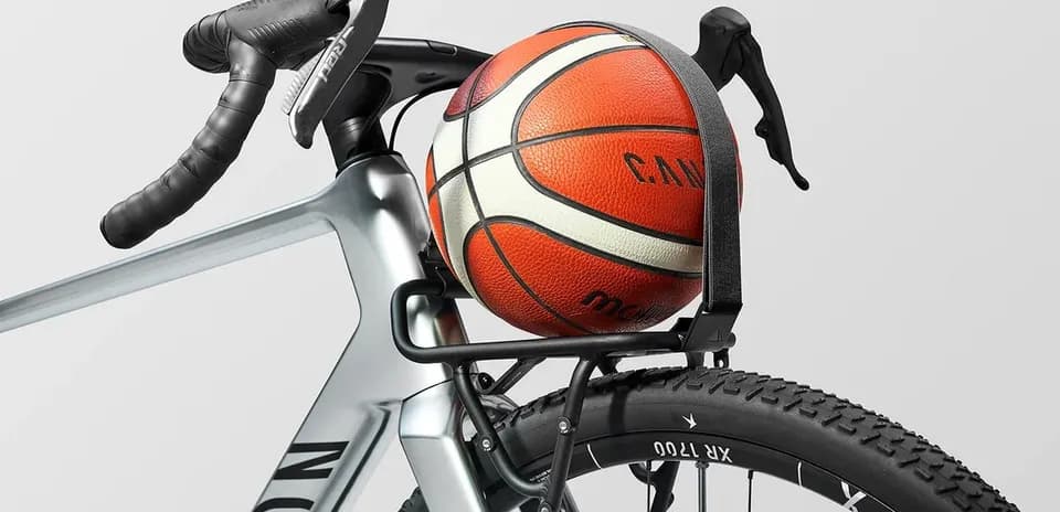Basketball resting on bicycle frame rack