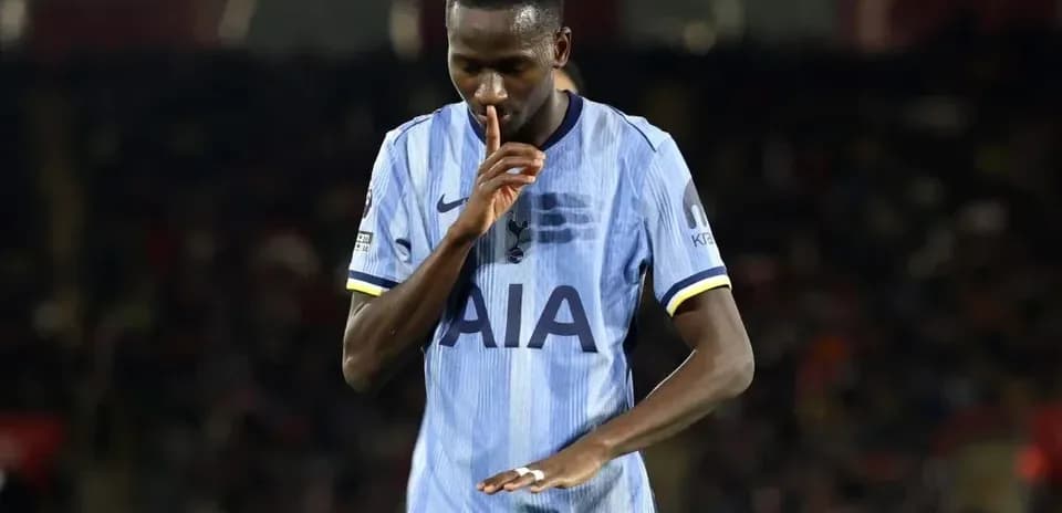 Player making a shushing gesture on the pitch