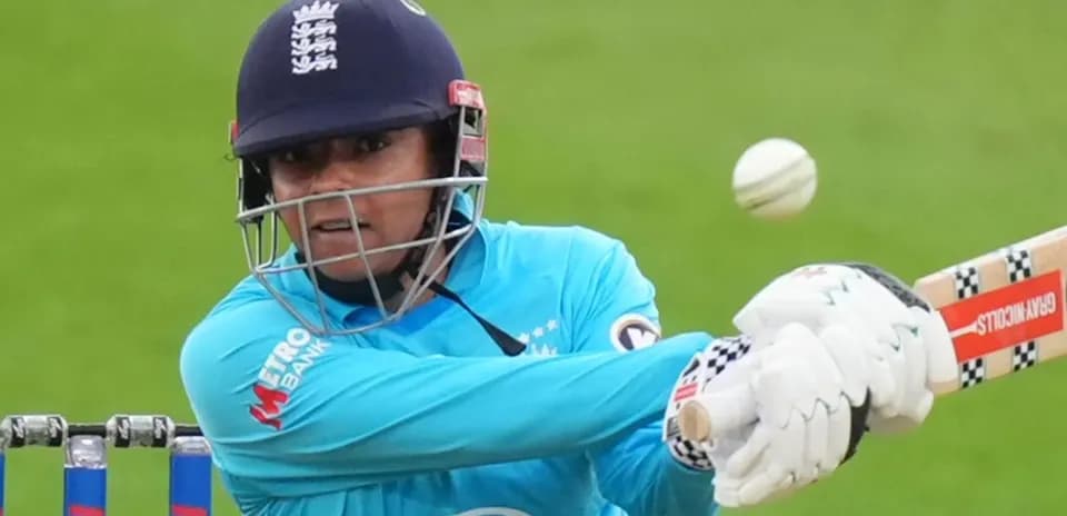 Cricketer batting with a ball approaching during match