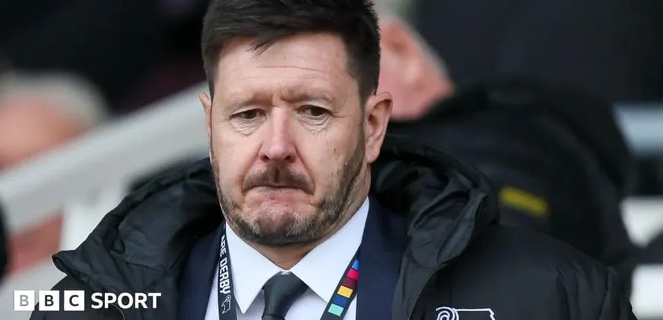 Manager looking serious during match on sidelines