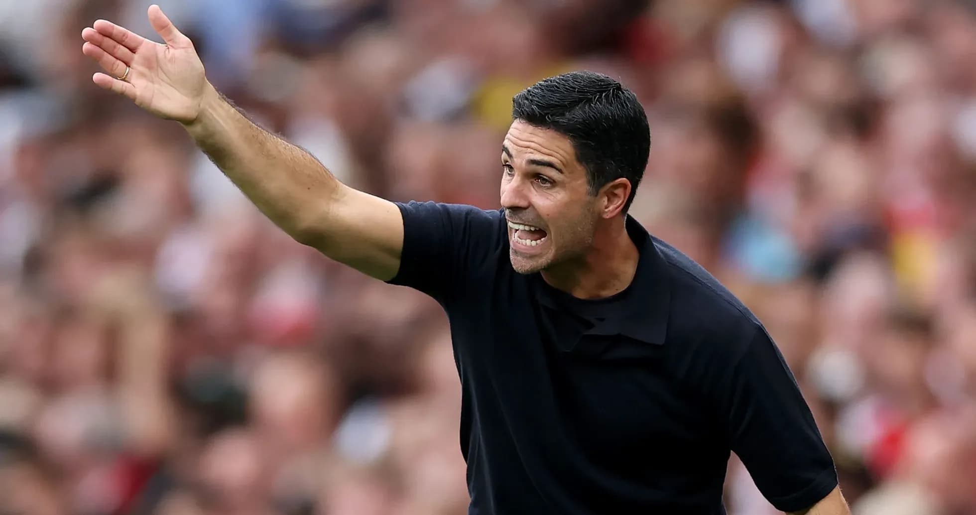 Coach gesturing during a match from the sidelines