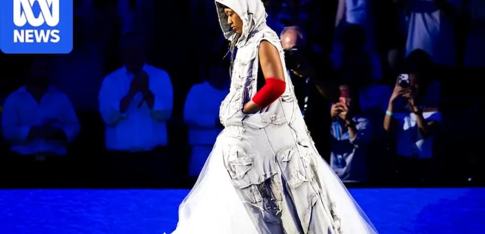 Person in unique outfit walking on stage