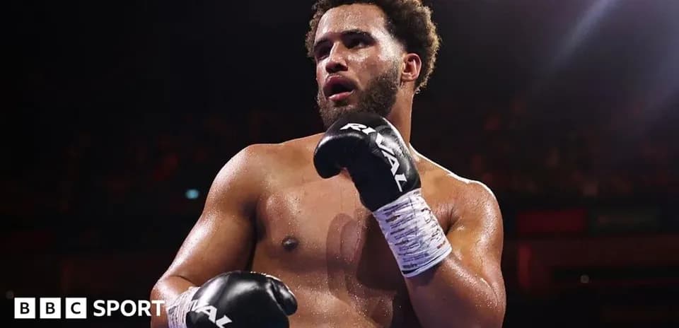 Boxer in gloves posing in the ring