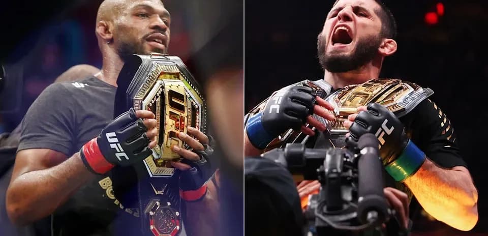 Two UFC champions holding their belts in celebration