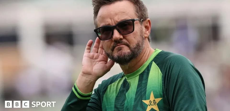 Coach listening intently during cricket training session