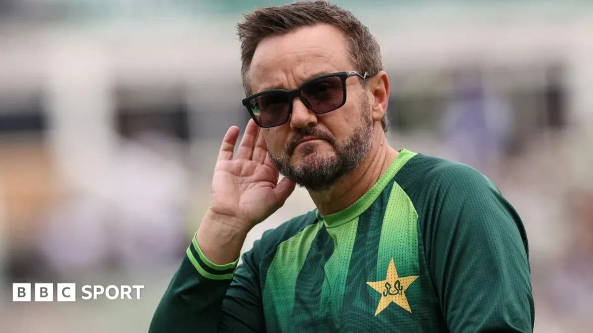 Coach listening intently during cricket training session