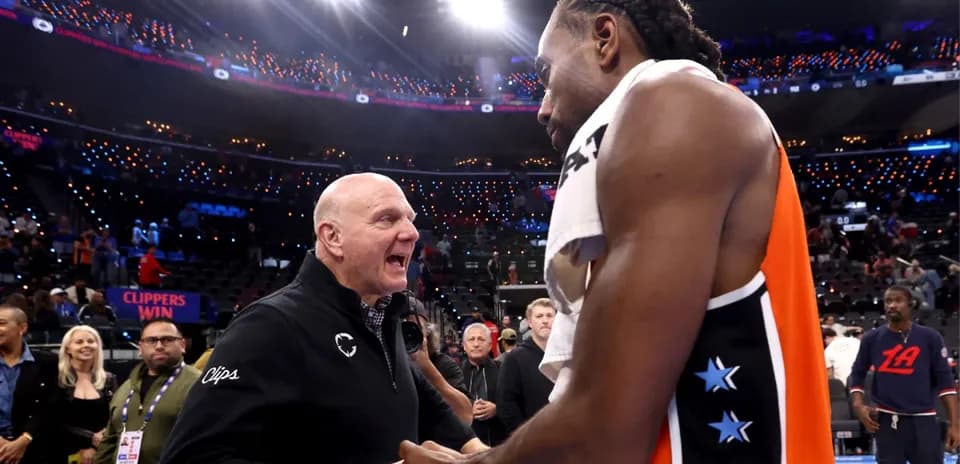 Kawhi Leonard and team owner Steve Ballmer celebrating