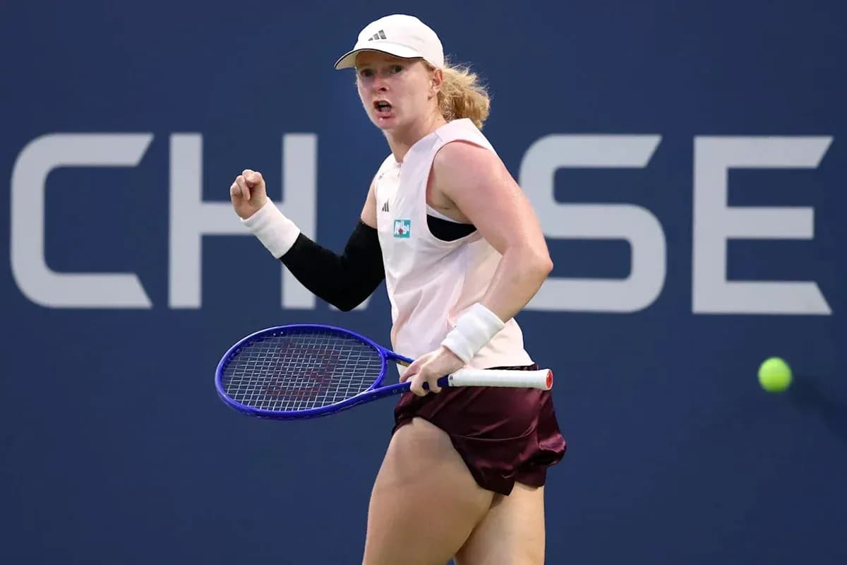 Tennis player celebrating a point on court
