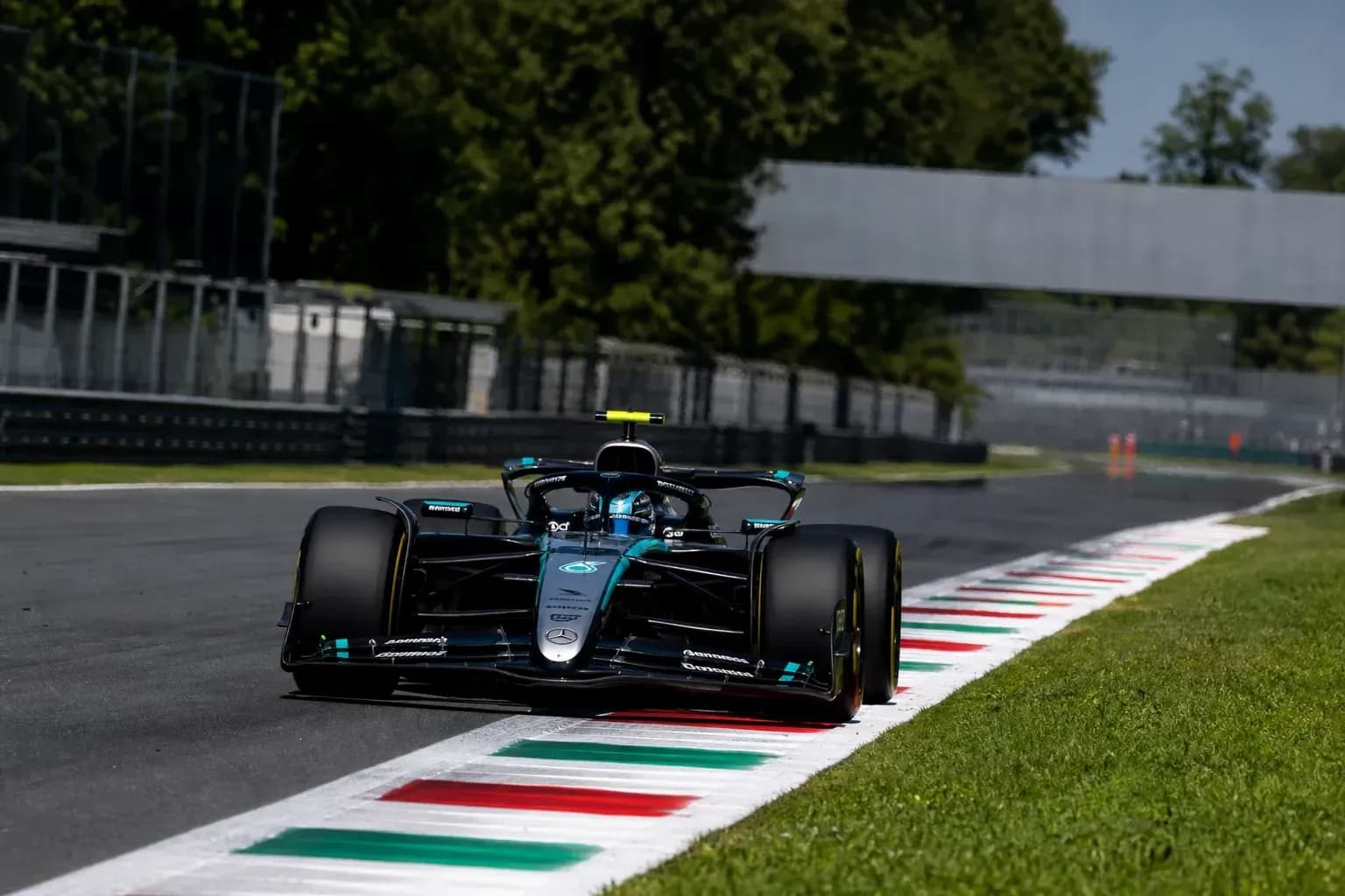 Formula 1 car navigating a corner on track