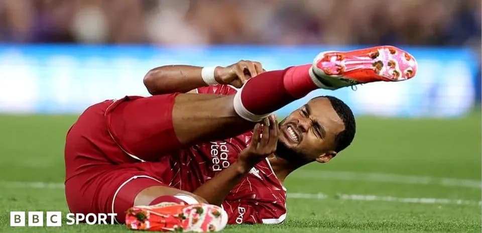 Player on ground holding injured leg during match