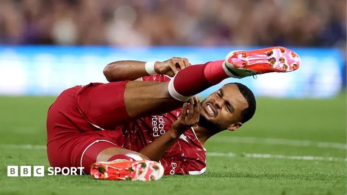 Player on ground holding injured leg during match