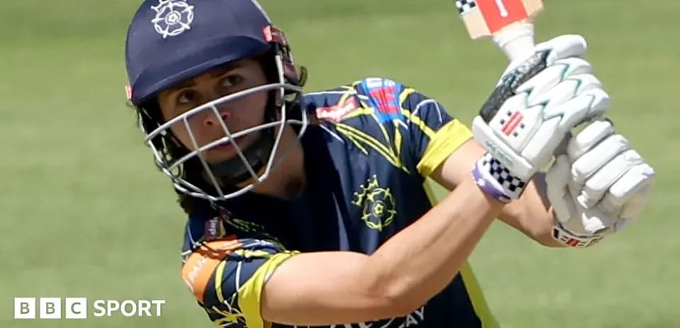 Cricketer preparing to hit the ball with bat