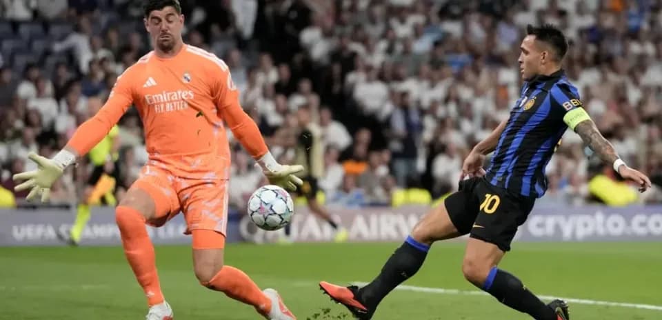 Goalkeeper saving shot during UEFA Champions League match