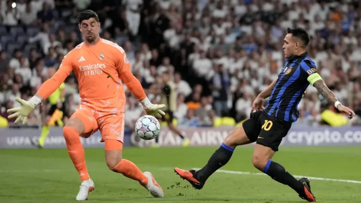 Goalkeeper saving shot during UEFA Champions League match