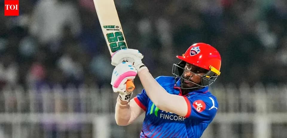 Batter hitting ball during cricket match