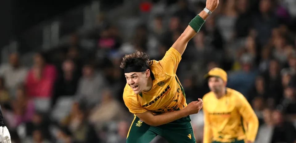 Bowler delivering a ball during cricket match