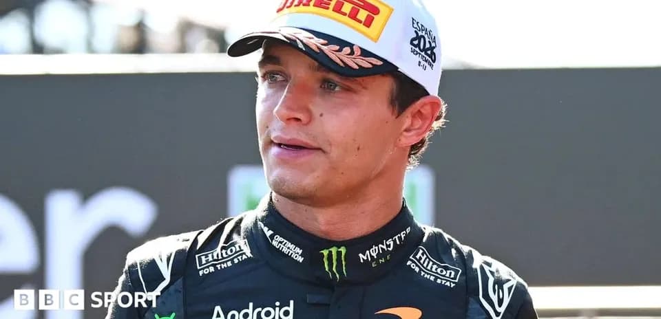 Racing driver in McLaren outfit at event