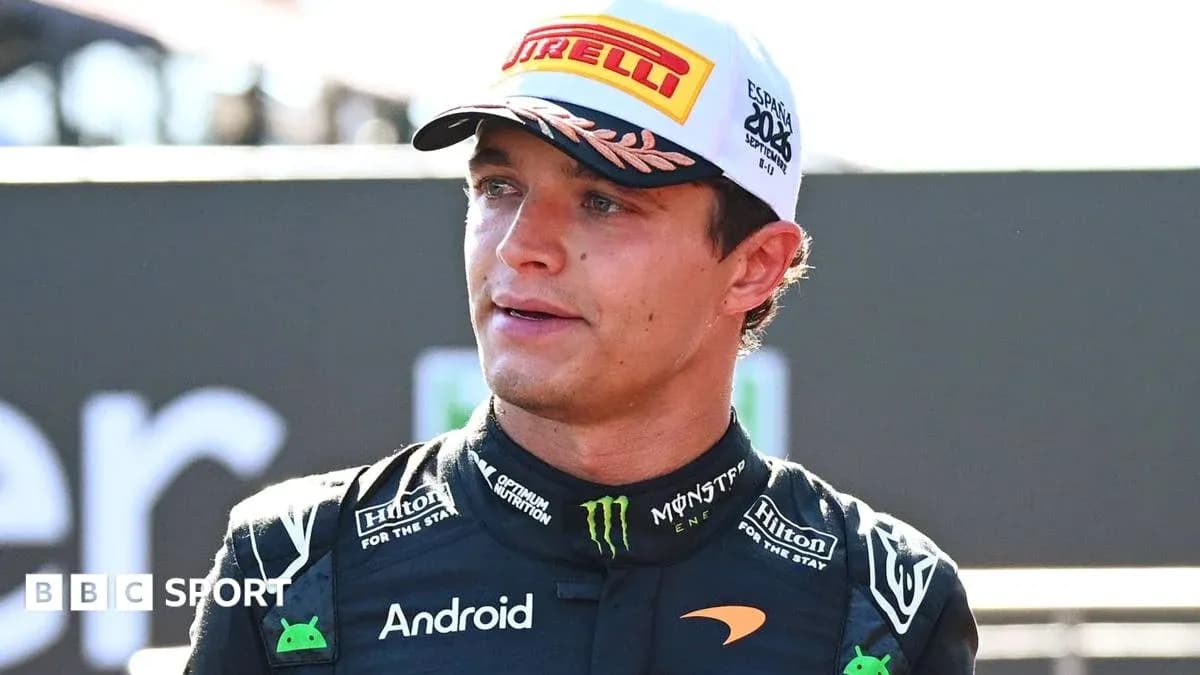 Racing driver in McLaren outfit at event