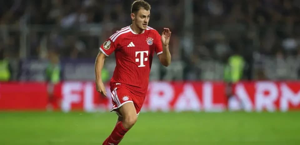 Player running on the pitch in Bayern Munich kit