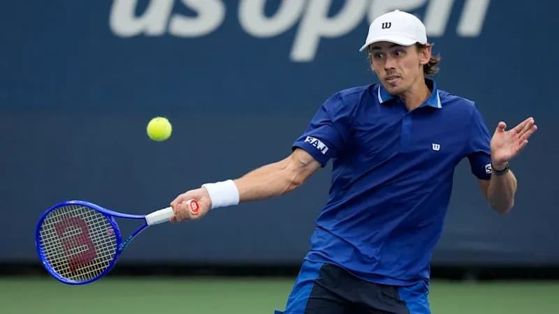 Tennis player hitting a forehand shot on court