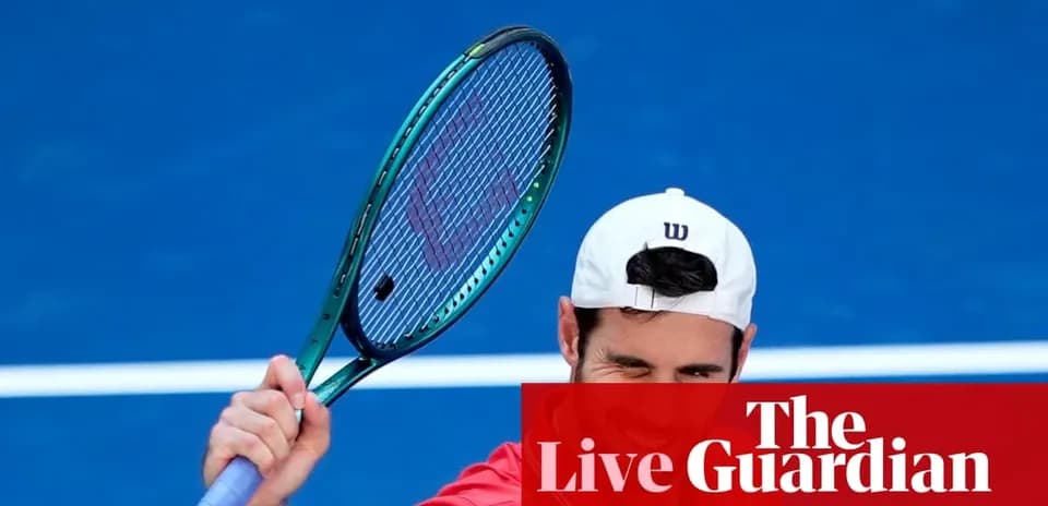 Tennis player preparing to serve on court