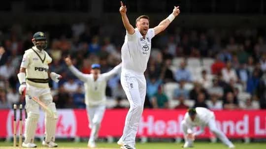 Bowler celebrating wicket with teammates during match
