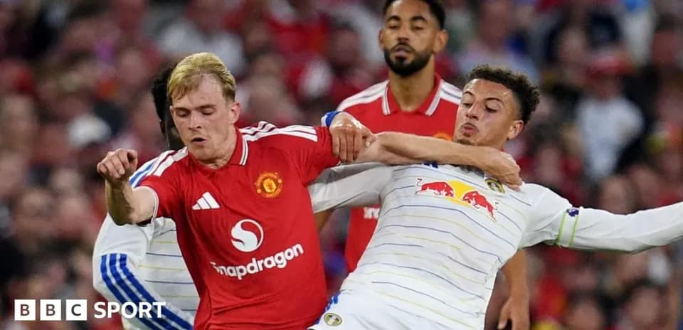 Two players battling for the ball during match