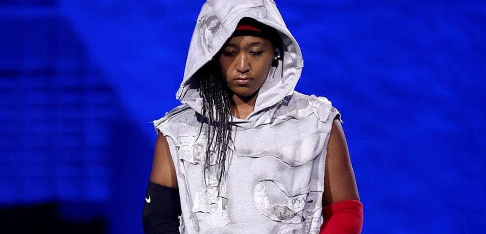 Athlete wearing a hooded outfit on stage