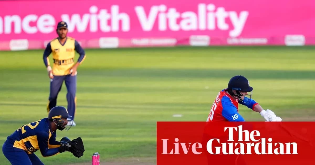Batsman playing a shot with wicketkeeper behind