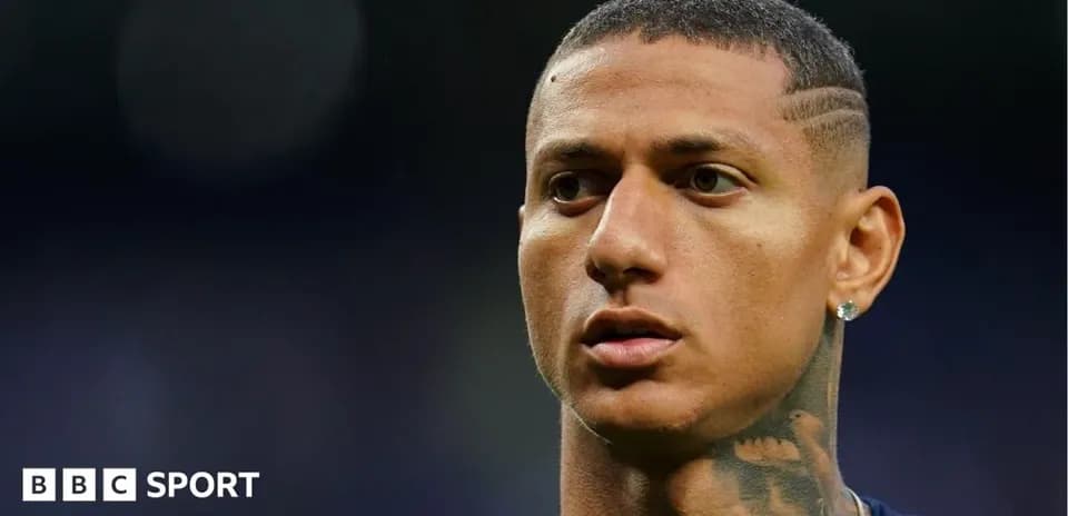 Close-up of player with short hair and tattoos
